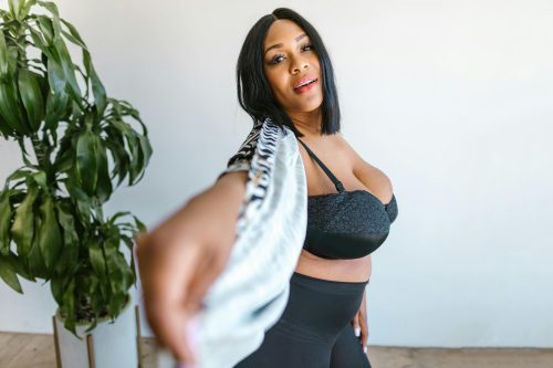 Confident curvy woman portrait indoors